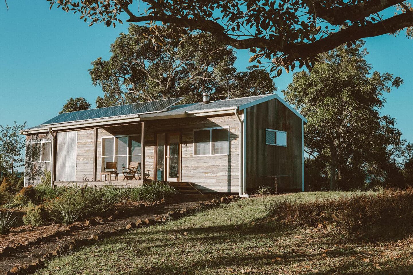 A small house sitting on top of a hill.