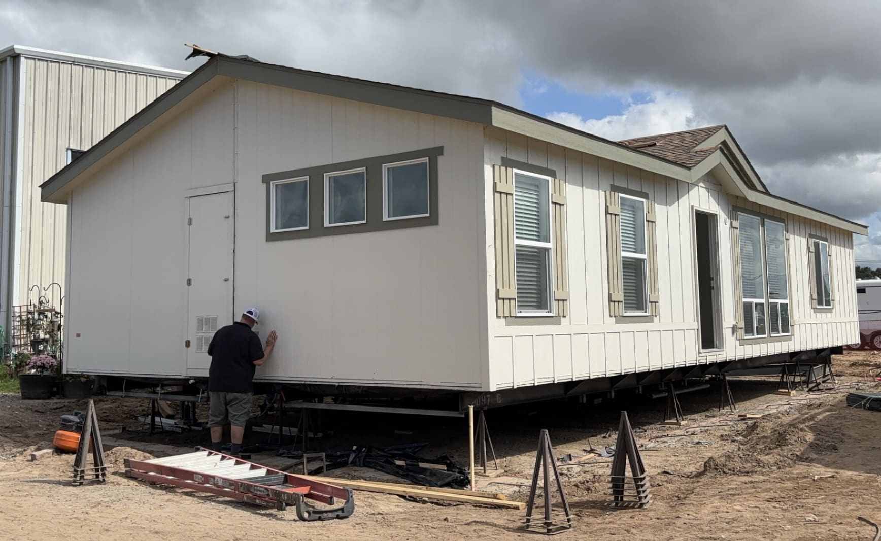 Light gray manufactured home exterior under construction in California